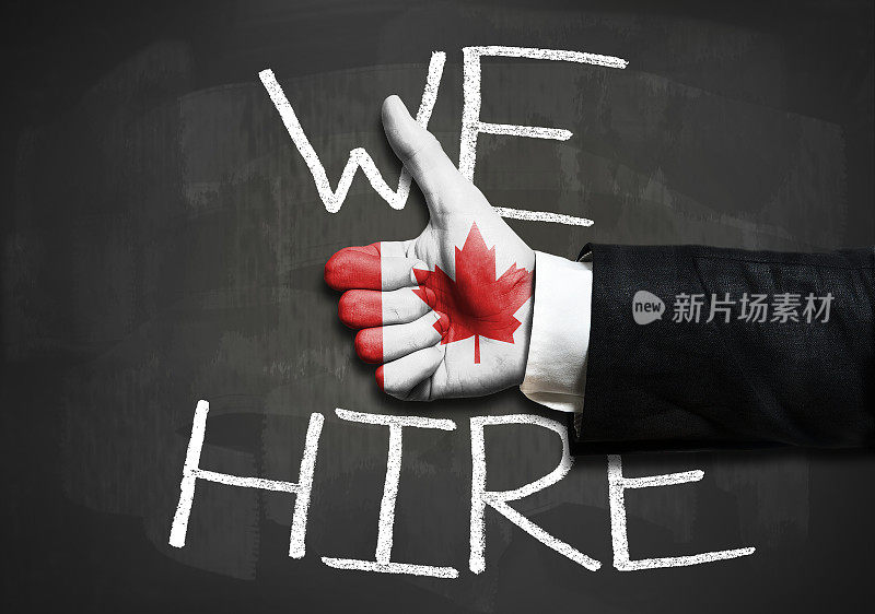 我们雇用-加拿大国旗超过商人手竖起大拇指的标志/国旗的概念